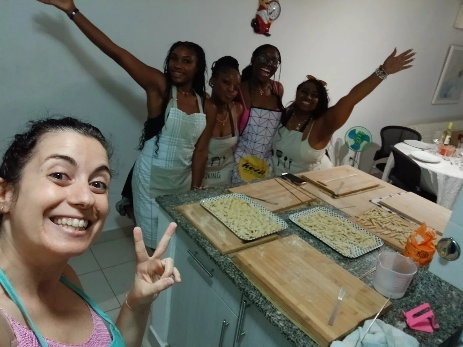 Guests celebrating after Luciana's pasta class